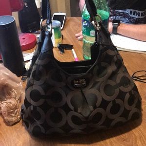 Black and maroon Coach bag